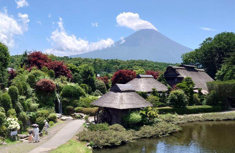Thatched-roof village with Mt. Fuji in the distance